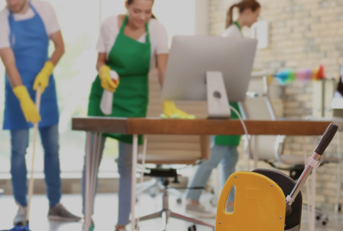 A porter servicing a common area during the school day